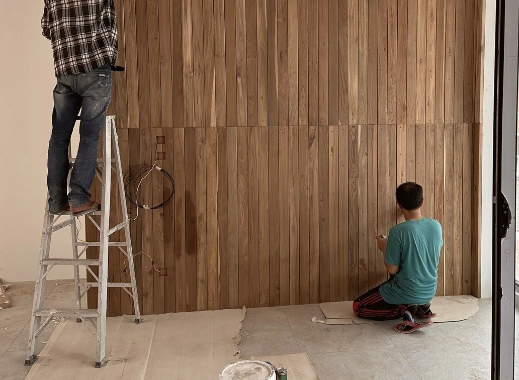 Installation of timber wall lining on site